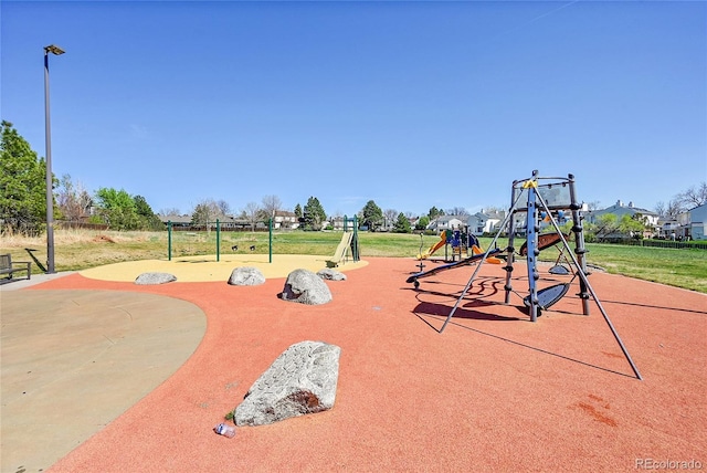 community playground featuring a yard
