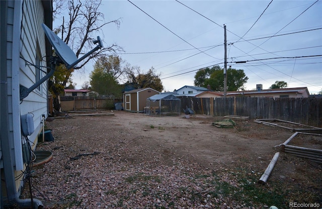 view of yard with a storage unit