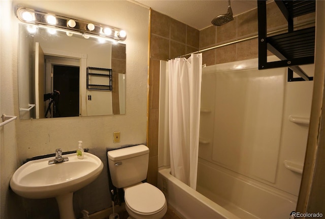 full bathroom with a textured ceiling, sink, toilet, and shower / bathtub combination with curtain