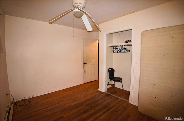 unfurnished bedroom with a closet, ceiling fan, and dark hardwood / wood-style floors