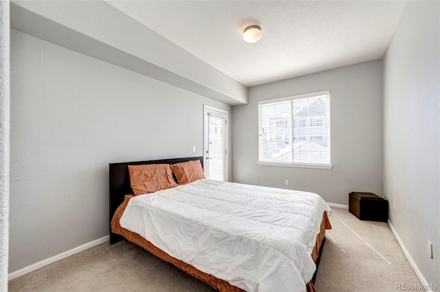 bedroom featuring light carpet