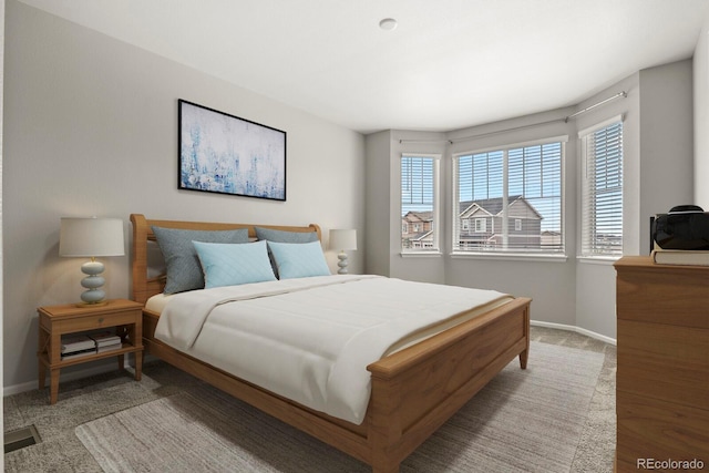 bedroom with carpet floors, visible vents, and baseboards