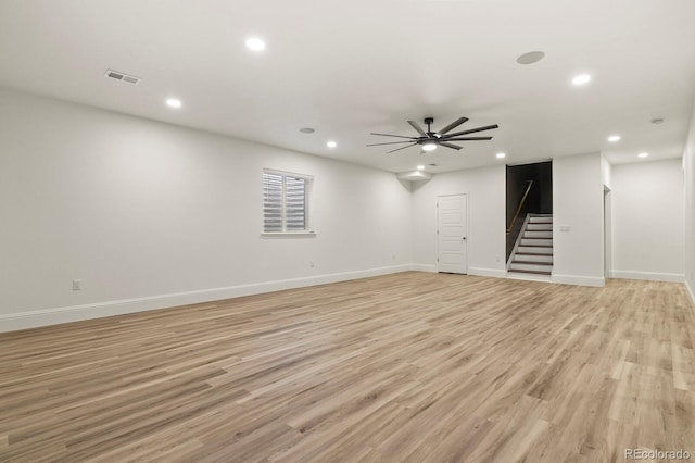 spare room with light wood-style flooring, recessed lighting, visible vents, a ceiling fan, and stairway