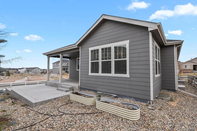 rear view of property featuring a patio