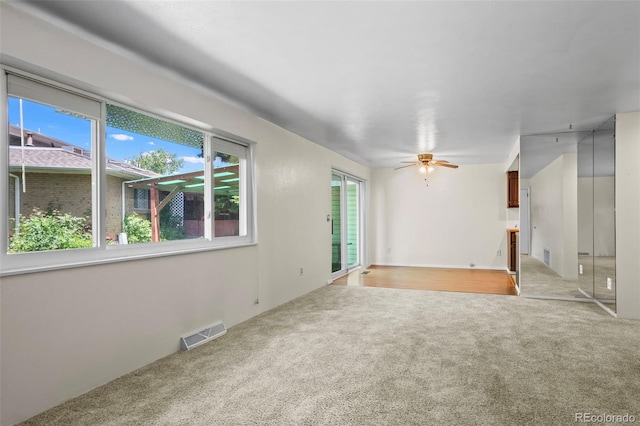 3631 W 79th Ave Unit A2, Westminster, CO 80030 - unfurnished room with light carpet, plenty of natural light, and a ceiling fan