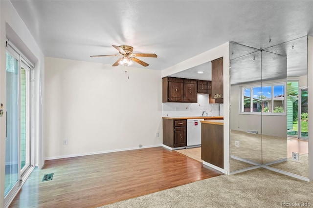 3631 W 79th Ave Unit A2, Westminster, CO 80030 - kitchen with dishwasher, dark brown cabinetry, healthy amount of natural light, and ceiling fan