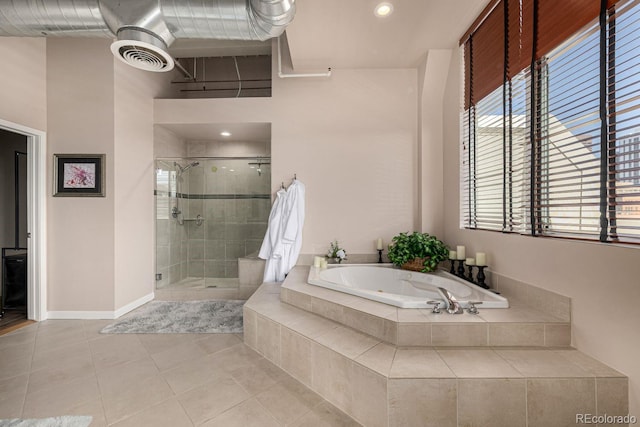 bathroom with a stall shower, baseboards, visible vents, tile patterned floors, and a bath