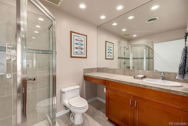 bathroom featuring vanity, tile patterned flooring, visible vents, and a shower stall