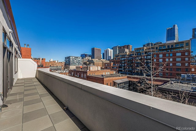 balcony featuring a city view