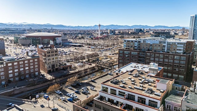 property's view of city with a mountain view