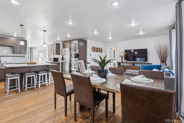 dining space featuring light hardwood / wood-style floors