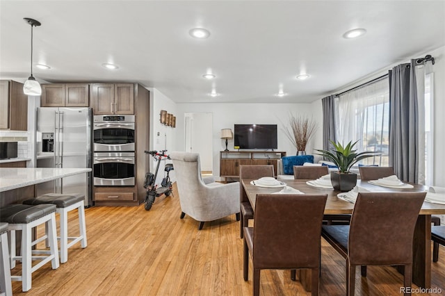 dining room featuring light wood-type flooring