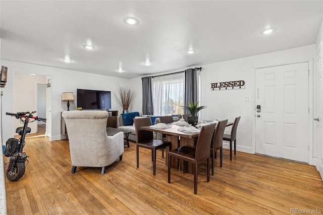 dining area with hardwood / wood-style floors