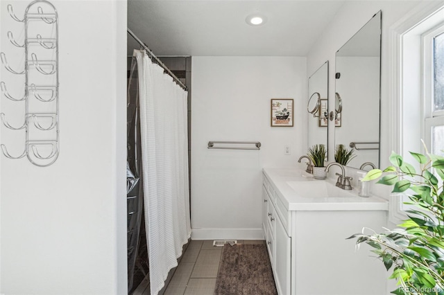 bathroom with vanity and tile patterned floors