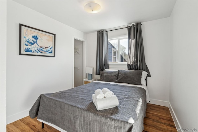 bedroom featuring dark hardwood / wood-style floors