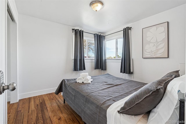 bedroom featuring a closet and dark hardwood / wood-style floors