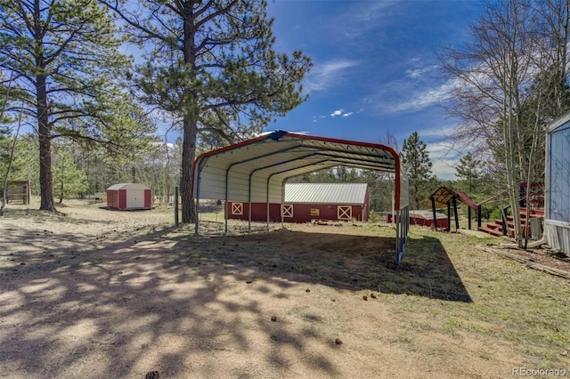 1360 Kiowa Rd, Florissant, CO 80816 - view of vehicle parking featuring a storage shed, a carport, and driveway