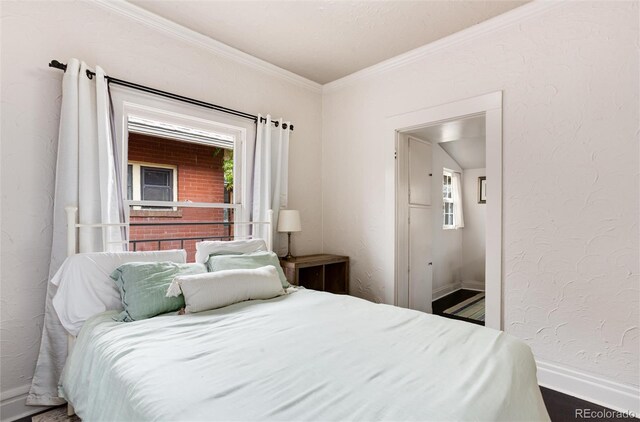 260 N Grant St, Denver, CO 80203 - bedroom featuring baseboards and crown molding