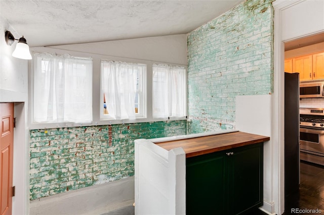 260 N Grant St, Denver, CO 80203 - bathroom featuring lofted ceiling, decorative backsplash, and wood finished floors
