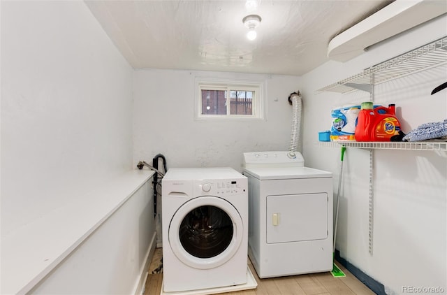 260 N Grant St, Denver, CO 80203 - laundry room with washing machine and clothes dryer and light wood finished floors