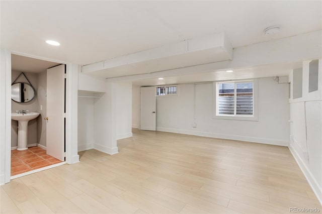 260 N Grant St, Denver, CO 80203 - below grade area with light wood-style floors, a sink, baseboards, and recessed lighting