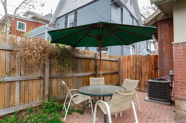 260 N Grant St, Denver, CO 80203 - view of patio with central AC, a fenced backyard, a pergola, and outdoor dining area