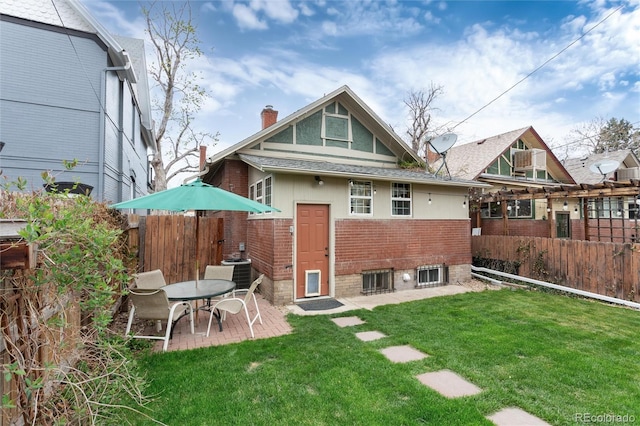 260 N Grant St, Denver, CO 80203 - back of property featuring brick siding, a chimney, a patio area, central air condition unit, and roof with shingles