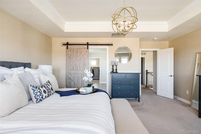 bedroom featuring a raised ceiling, ornamental molding, a chandelier, light colored carpet, and a barn door