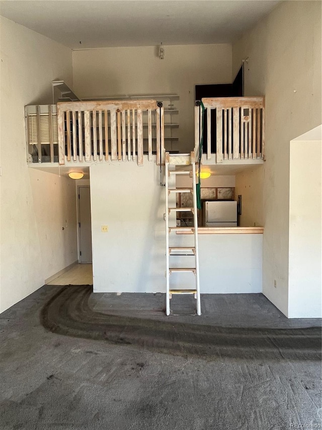 staircase featuring carpet floors