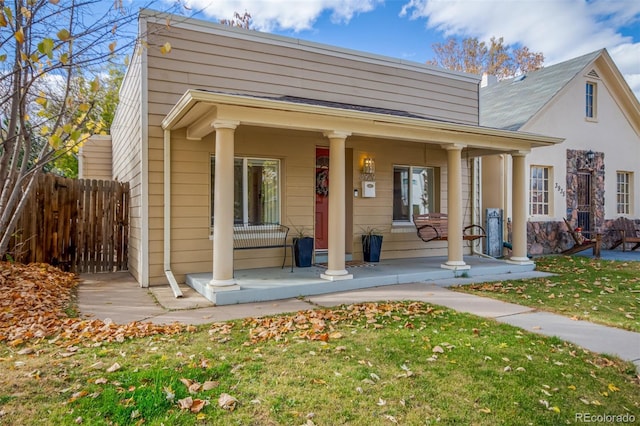 exterior space featuring a porch and a front yard