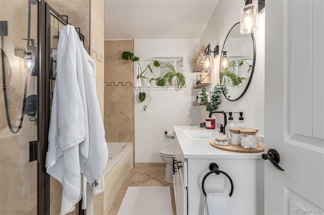 full bathroom featuring vanity, combined bath / shower with glass door, and toilet