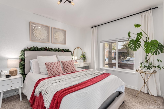 bedroom with light colored carpet