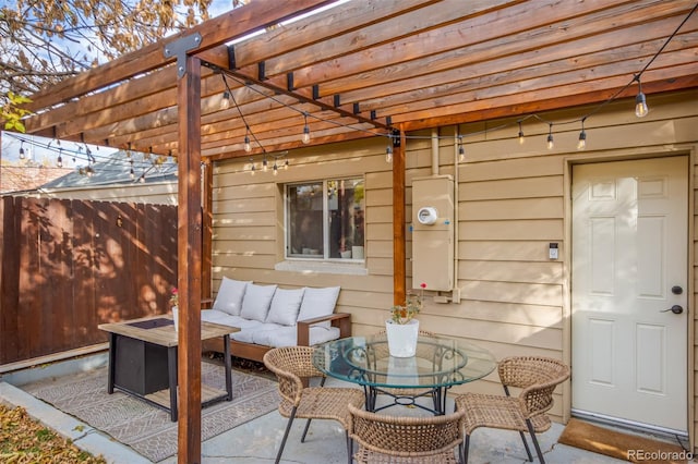 view of patio / terrace with an outdoor living space and a pergola