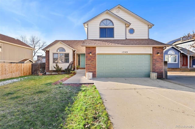 front of property with a garage and a front yard