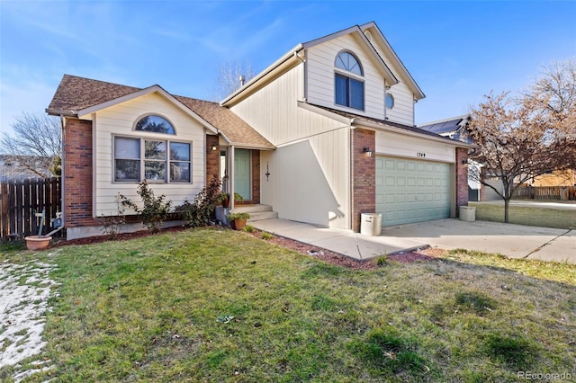 view of front of house featuring a front yard and a garage