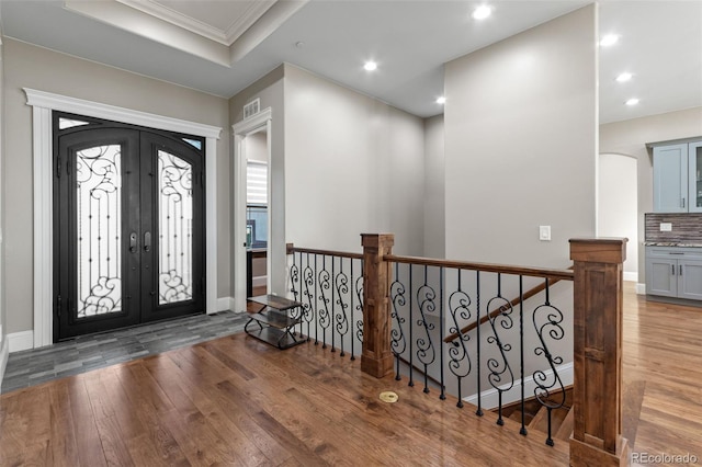 29303 E 165th Ave, Brighton, CO 80603 - foyer entrance featuring wood finished floors, ornamental molding, recessed lighting, french doors, and healthy amount of natural light