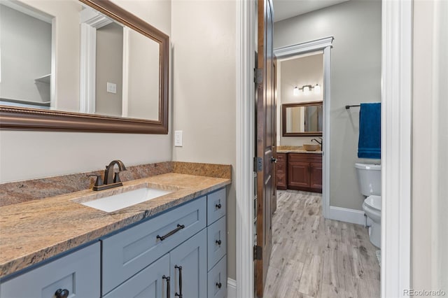 29303 E 165th Ave, Brighton, CO 80603 - bathroom with vanity and wood finished floors