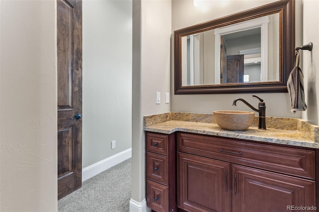 29303 E 165th Ave, Brighton, CO 80603 - bathroom featuring vanity and baseboards