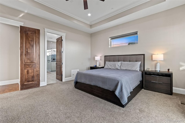 29303 E 165th Ave, Brighton, CO 80603 - carpeted bedroom featuring ornamental molding, a tray ceiling, recessed lighting, a ceiling fan, and connected bathroom