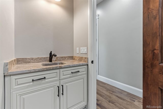 29303 E 165th Ave, Brighton, CO 80603 - bathroom featuring wood finished floors and vanity