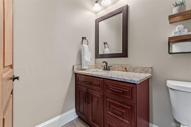 29303 E 165th Ave, Brighton, CO 80603 - bathroom featuring vanity and toilet