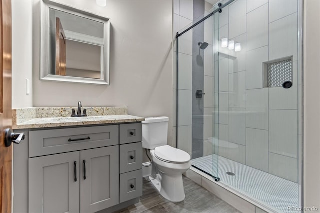 29303 E 165th Ave, Brighton, CO 80603 - full bath featuring a shower stall, vanity, and wood finished floors