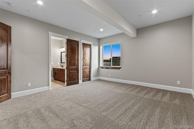 29303 E 165th Ave, Brighton, CO 80603 - unfurnished bedroom featuring light colored carpet, recessed lighting, ensuite bath, and beam ceiling