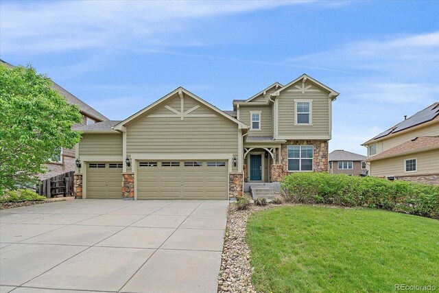 6461 S Ider St, Aurora, CO 80016 - craftsman inspired home with driveway, a garage, and stone siding