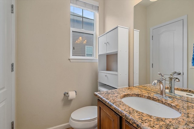 6461 S Ider St, Aurora, CO 80016 - bathroom with vanity, toilet, and baseboards