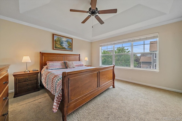 6461 S Ider St, Aurora, CO 80016 - bedroom with light colored carpet, a tray ceiling, crown molding, baseboards, and ceiling fan