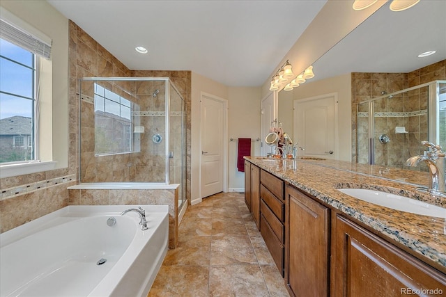 6461 S Ider St, Aurora, CO 80016 - full bath with a bath, healthy amount of natural light, and double vanity
