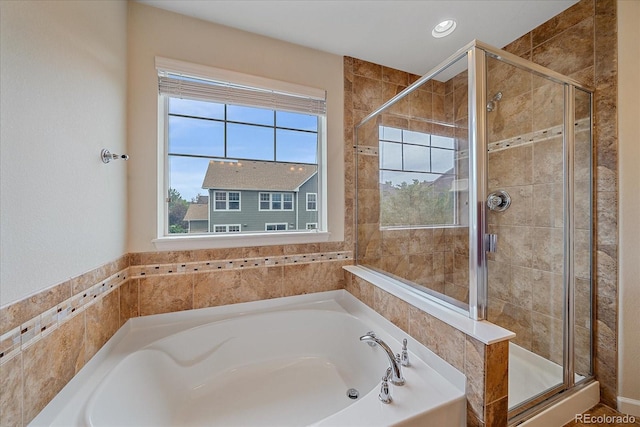 6461 S Ider St, Aurora, CO 80016 - full bath featuring healthy amount of natural light, a bath, and a shower stall