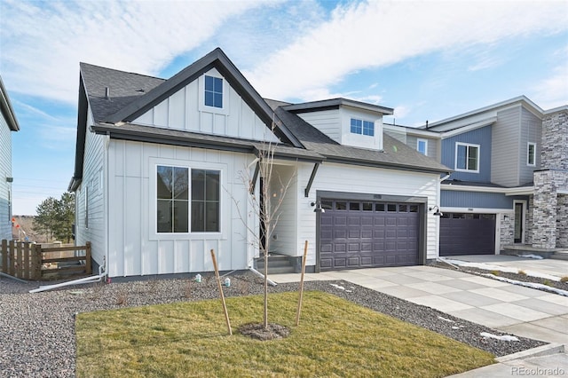 view of front facade with a front yard and a garage