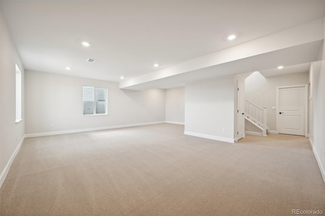 basement with light colored carpet